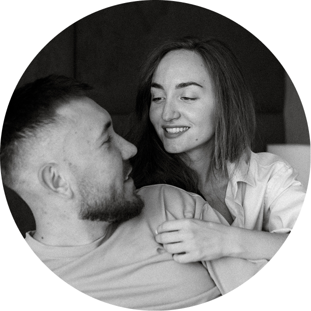 Woman surprising husband in bed