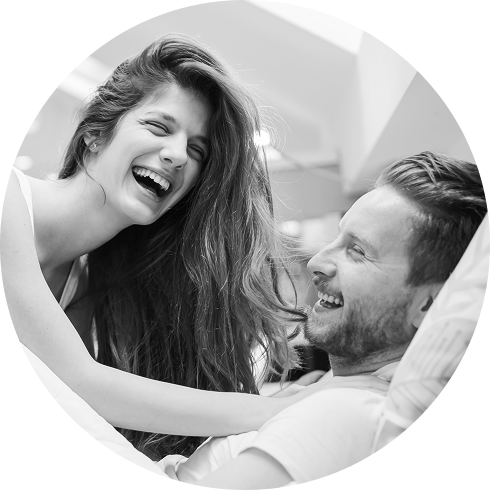 happy couple having fun while playing game for couples in bed