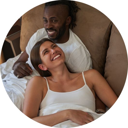 happy couple in bed at home on valentines