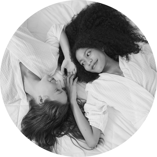 happy lesbian couple in bed