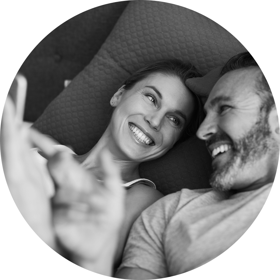 Male couple playing game for couples on table in bed